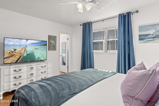 bedroom featuring a textured ceiling and ceiling fan