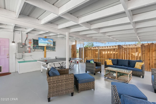 view of patio with fence and an outdoor living space