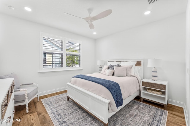bedroom featuring recessed lighting, baseboards, a ceiling fan, and wood finished floors