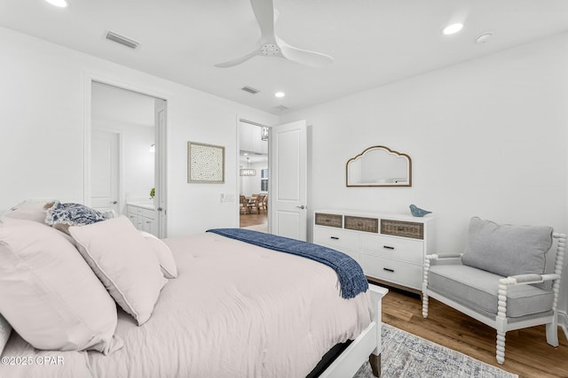 bedroom featuring recessed lighting, ceiling fan, wood finished floors, and visible vents