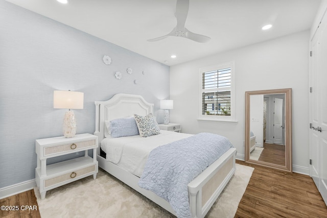 bedroom featuring baseboards, ceiling fan, recessed lighting, and wood finished floors