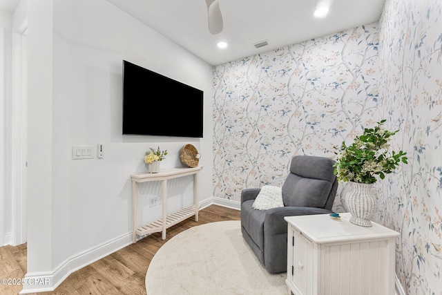 living area with baseboards, recessed lighting, light wood-style flooring, and visible vents