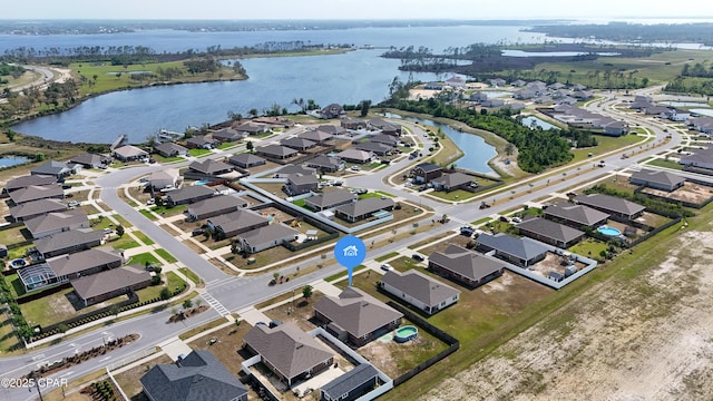 aerial view featuring a residential view and a water view
