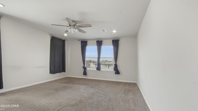 carpeted spare room featuring recessed lighting, ceiling fan, baseboards, and visible vents
