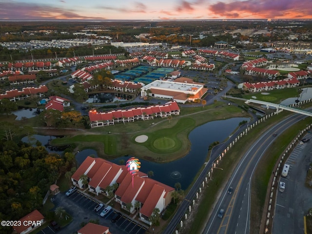aerial view featuring view of golf course and a water view