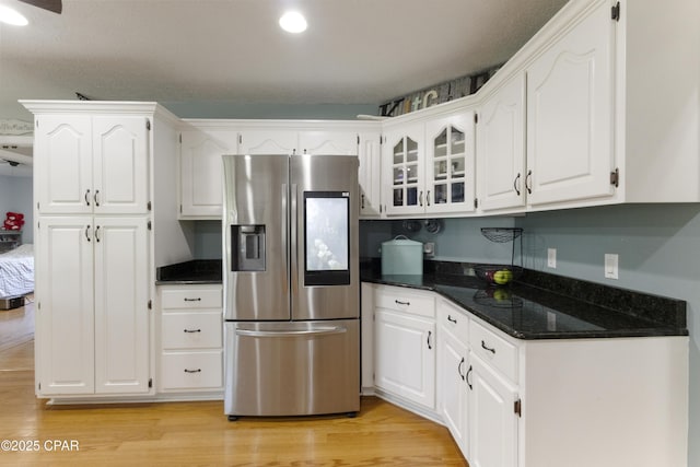 924 N College Blvd, Lynn Haven, FL 32444 - kitchen featuring white cabinetry, recessed lighting, stainless steel fridge with ice dispenser, and light wood-style flooring