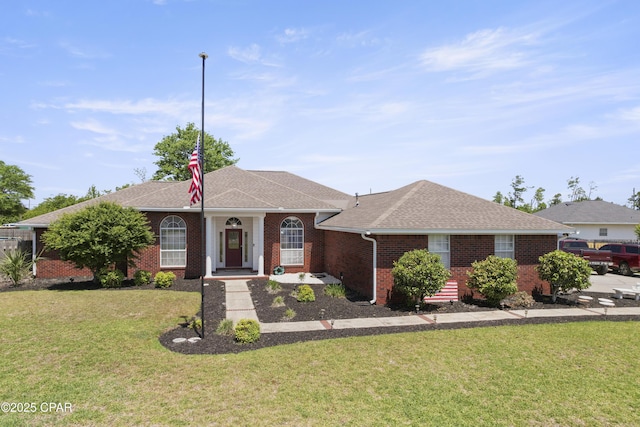924 N College Blvd, Lynn Haven, FL 32444 - single story home with roof with shingles, brick siding, and a front lawn