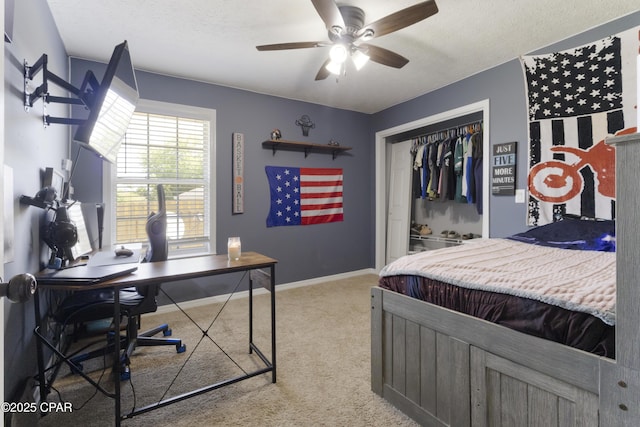 924 N College Blvd, Lynn Haven, FL 32444 - bedroom featuring a textured ceiling, ceiling fan, a closet, baseboards, and light carpet