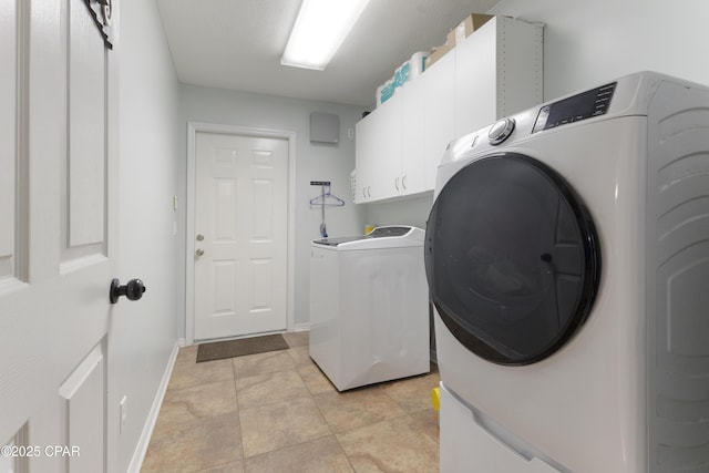 924 N College Blvd, Lynn Haven, FL 32444 - clothes washing area featuring cabinet space, washing machine and clothes dryer, and baseboards