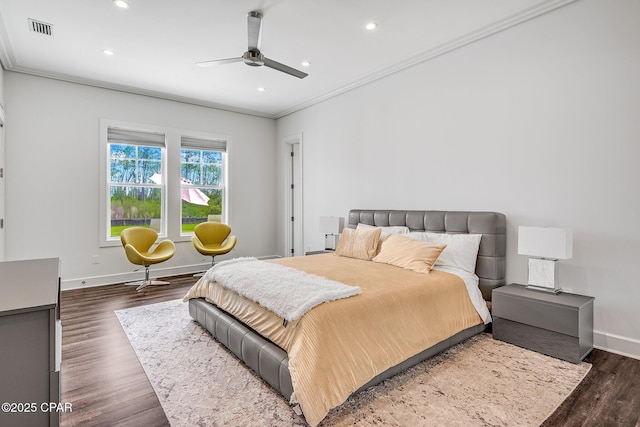 bedroom featuring dark wood finished floors, recessed lighting, ornamental molding, baseboards, and visible vents