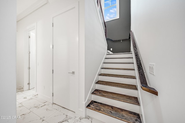 stairway with marble finish floor