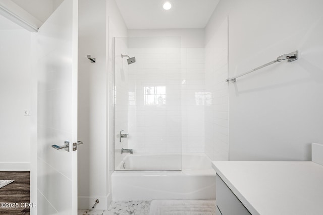 full bath with baseboards, recessed lighting, and shower / washtub combination
