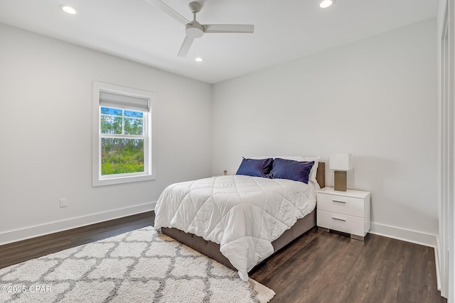 bedroom with dark wood-style floors, recessed lighting, ceiling fan, and baseboards