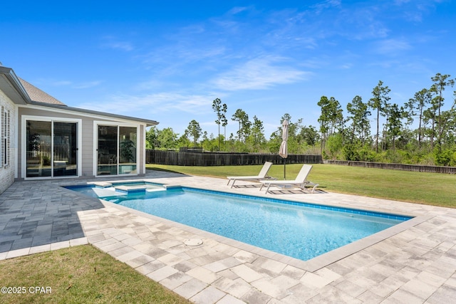 view of pool with a patio area, a yard, a pool with connected hot tub, and a fenced backyard