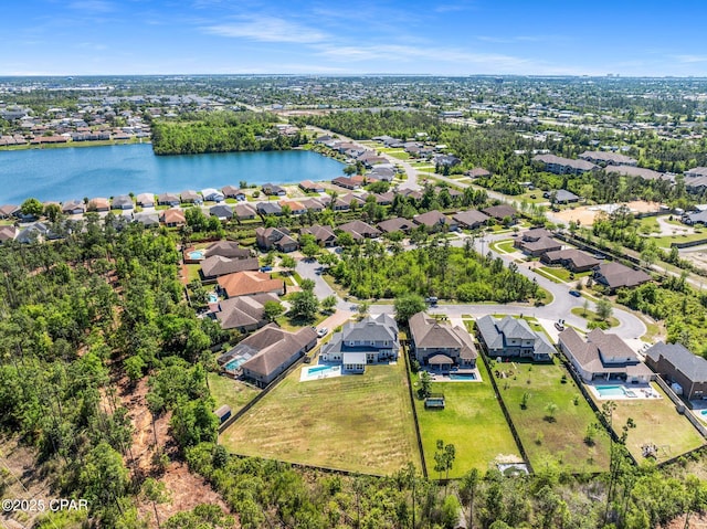 aerial view featuring a residential view and a water view