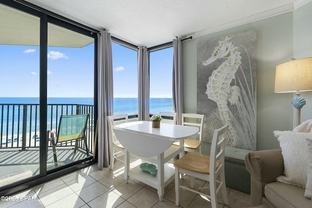 9850 S Thomas Dr Unit 810E, Panama City, FL 32408 - sunroom featuring a water view