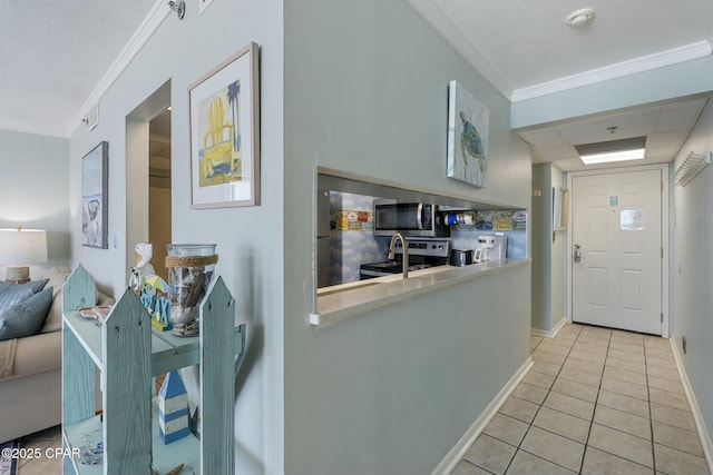 9850 S Thomas Dr Unit 810E, Panama City, FL 32408 - corridor featuring crown molding, light tile patterned floors, and baseboards