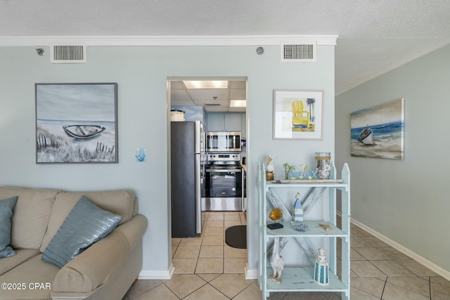 9850 S Thomas Dr Unit 810E, Panama City, FL 32408 - living area with crown molding, light tile patterned floors, baseboards, and a textured ceiling