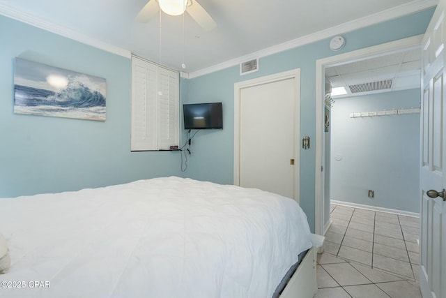 9850 S Thomas Dr Unit 810E, Panama City, FL 32408 - bedroom featuring light tile patterned floors, ornamental molding, ceiling fan, and baseboards