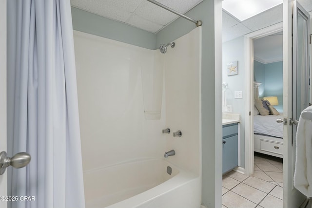 9850 S Thomas Dr Unit 810E, Panama City, FL 32408 - bathroom with shower / bath combo, a drop ceiling, connected bathroom, tile patterned flooring, and vanity