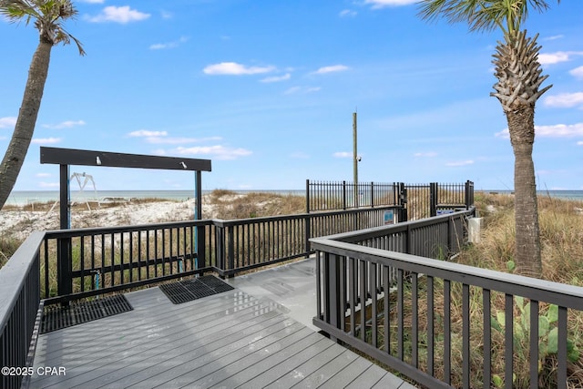 9850 S Thomas Dr Unit 810E, Panama City, FL 32408 - wooden terrace featuring view of water and beach
