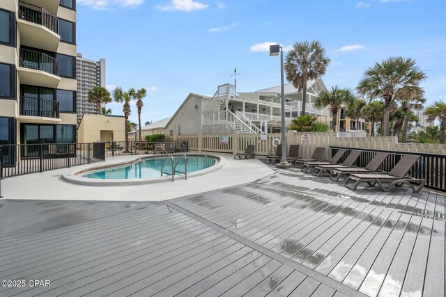 9850 S Thomas Dr Unit 810E, Panama City, FL 32408 - community pool featuring fence and a wooden deck