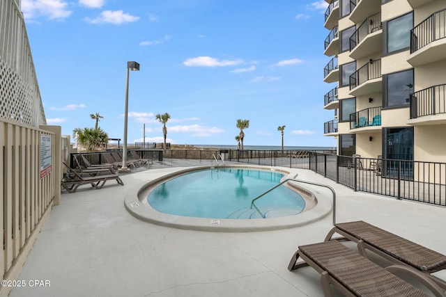 9850 S Thomas Dr Unit 810E, Panama City, FL 32408 - community pool featuring a patio and fence