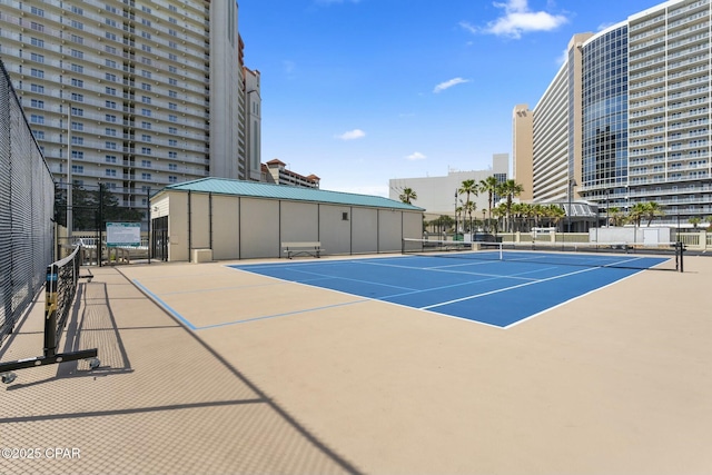 9850 S Thomas Dr Unit 810E, Panama City, FL 32408 - view of tennis court featuring fence and community basketball court