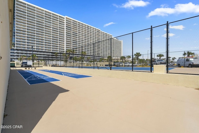 9850 S Thomas Dr Unit 810E, Panama City, FL 32408 - view of property's community featuring fence and a tennis court