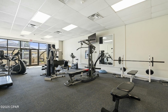 9850 S Thomas Dr Unit 810E, Panama City, FL 32408 - workout area with a paneled ceiling, expansive windows, and baseboards