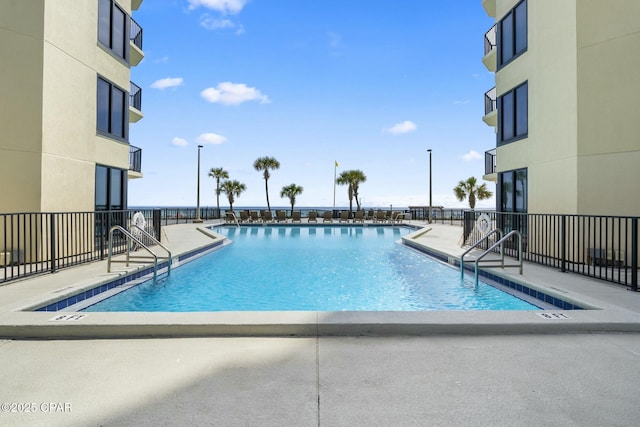 9850 S Thomas Dr Unit 810E, Panama City, FL 32408 - community pool with a patio and fence