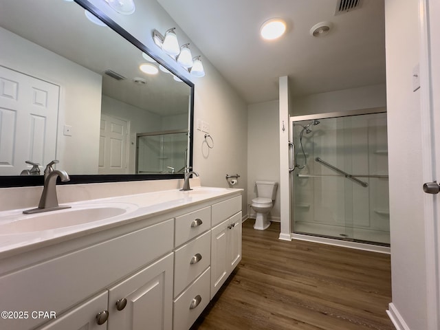 full bathroom featuring a sink, a stall shower, and visible vents