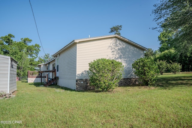 view of property exterior with a lawn