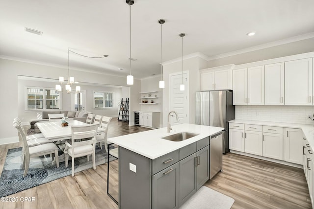 19 Mckenna Way, Santa Rosa Beach, FL 32459 - kitchen with a sink, gray cabinetry, light countertops, dishwasher, and ornamental molding