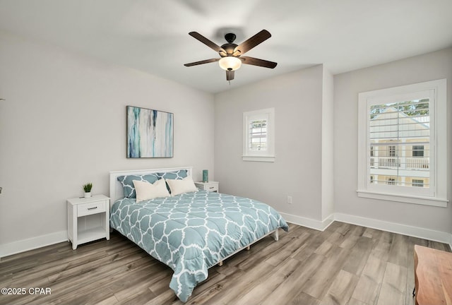 19 Mckenna Way, Santa Rosa Beach, FL 32459 - bedroom with ceiling fan, wood finished floors, and baseboards