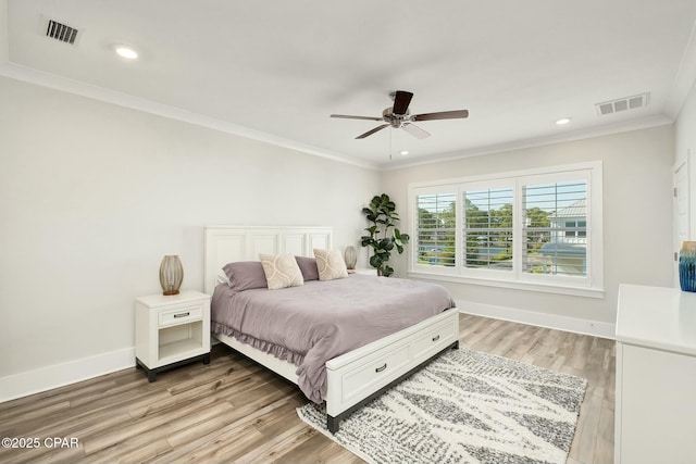 19 Mckenna Way, Santa Rosa Beach, FL 32459 - bedroom featuring baseboards, visible vents, light wood-type flooring, and crown molding