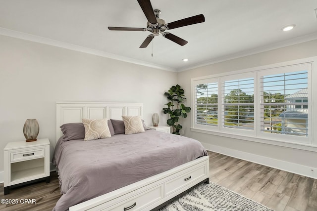 19 Mckenna Way, Santa Rosa Beach, FL 32459 - bedroom with baseboards, recessed lighting, wood finished floors, and crown molding