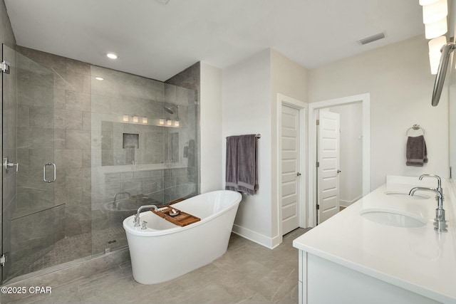 19 Mckenna Way, Santa Rosa Beach, FL 32459 - full bathroom with a sink, a shower stall, double vanity, visible vents, and a soaking tub