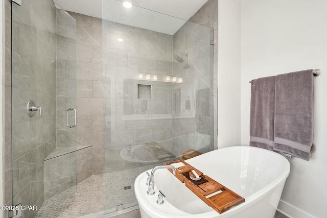 19 Mckenna Way, Santa Rosa Beach, FL 32459 - bathroom with a stall shower, recessed lighting, a freestanding bath, and baseboards
