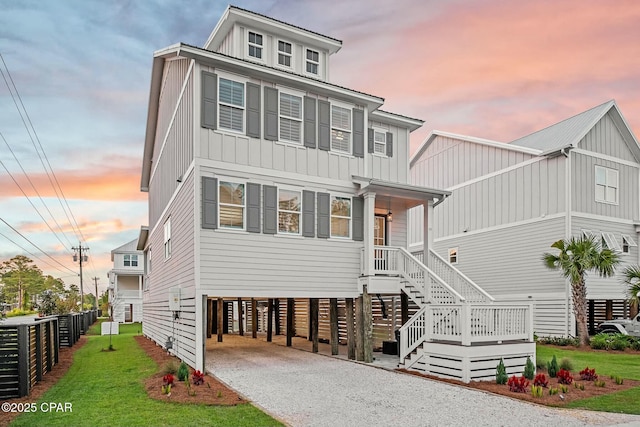 19 Mckenna Way, Santa Rosa Beach, FL 32459 - coastal home with board and batten siding, a carport, driveway, and a lawn