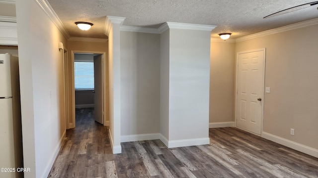 corridor with crown molding, a textured ceiling, wood finished floors, and baseboards