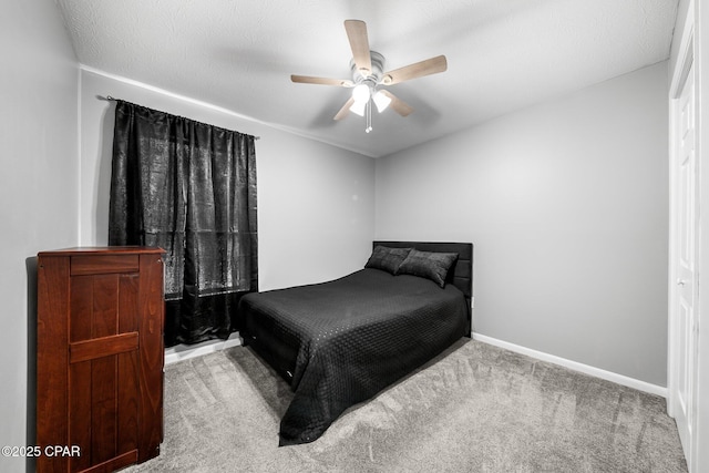 bedroom featuring carpet floors, baseboards, and ceiling fan