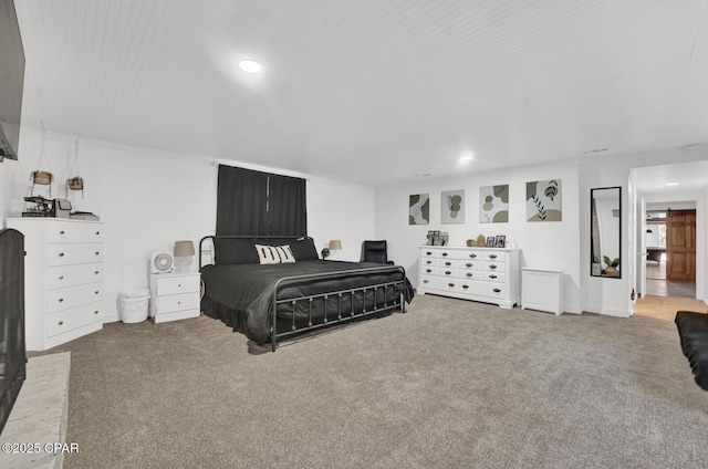 carpeted bedroom featuring recessed lighting