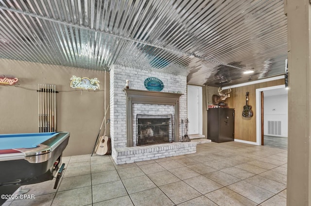 tiled living area with a fireplace, visible vents, and billiards