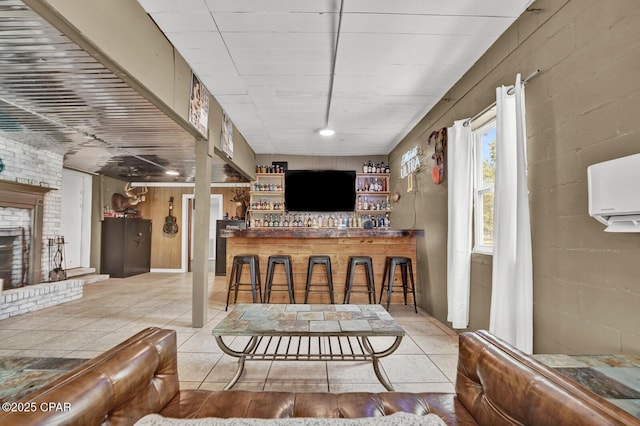 tiled living room with a dry bar and a fireplace