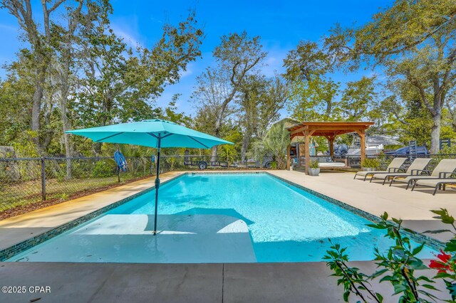 view of pool with a patio, fence, and a fenced in pool