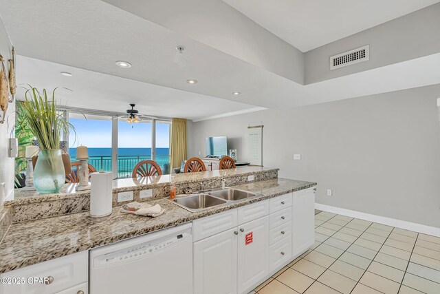 14701 Front Beach Rd Unit 834, Panama City Beach, FL 32413 - kitchen with dishwasher, a sink, ceiling fan, white cabinetry, and baseboards