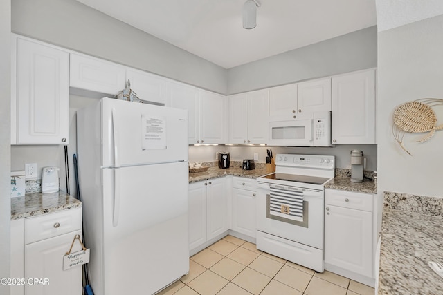 14701 Front Beach Rd Unit 834, Panama City Beach, FL 32413 - kitchen featuring white appliances, white cabinets, light tile patterned floors, and light stone countertops