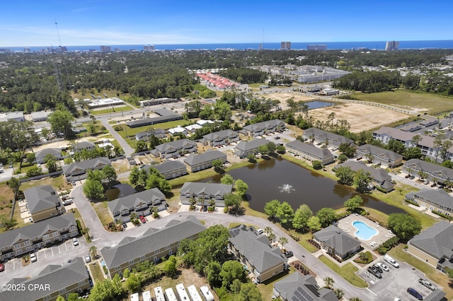 bird's eye view featuring a water view and a city view