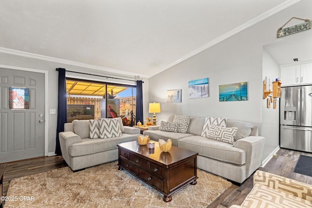 17462 Front Beach Rd Unit 24C, Panama City Beach, FL 32413 - living area with wood finished floors, vaulted ceiling, crown molding, and baseboards